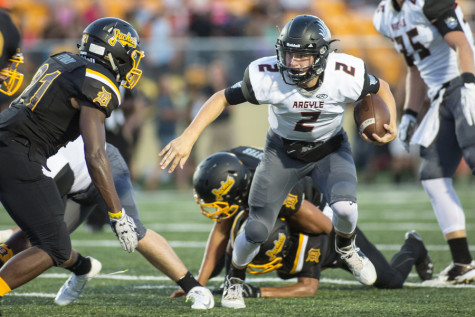 Argyle's Dane Ledford (2) runs the ball against Denison on Sept. 4, 2015 in Denison, Texas. (Christopher Piel/The Talon News)