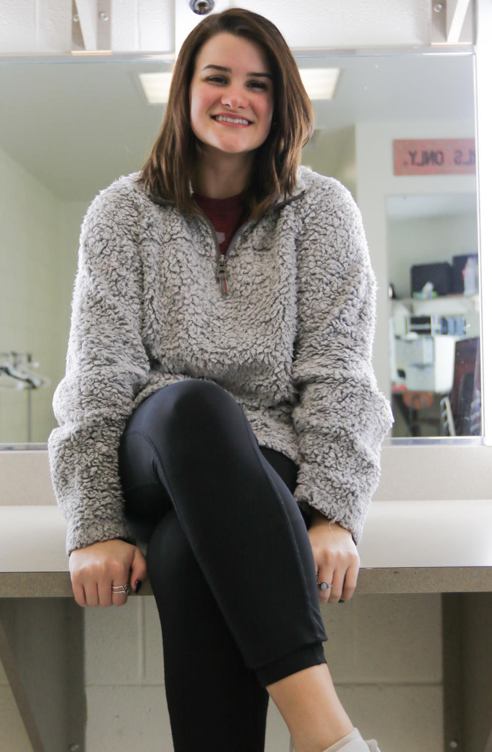 Junior Raleigh Turner smiles in the dressing room after college auditions on Feb. 7, 2018. (Hayden Calendine | The Talon News)