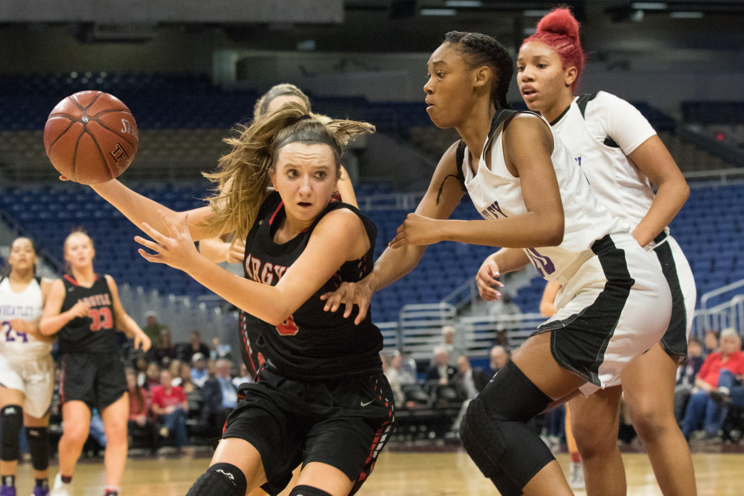 The Lady Eagles Rhyle McKinney drives to the goal in the state semi final game against Houston Wheatley in the UIL 4A State Semi-Final game, finishing the game with a winning score of 62-46. The team plays in the championship game against Veteran's Memorial tomorrow in the Alamodome at 7pm. (Campbell Wilmot/ The Talon News)