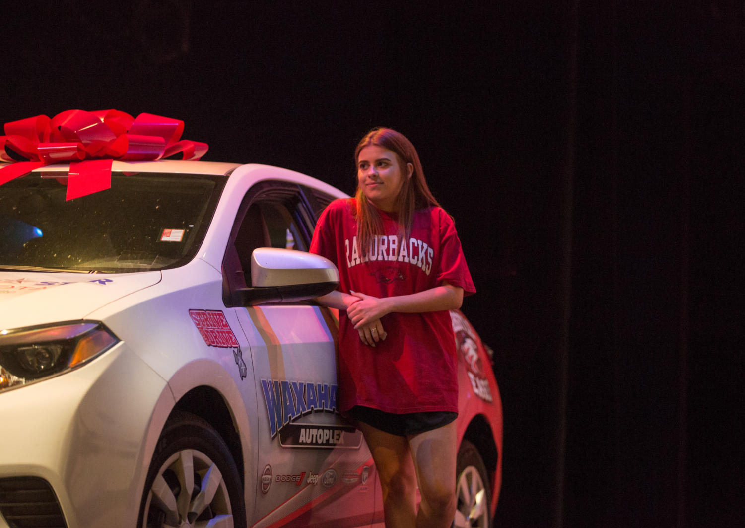 Sophomore Isabelle Adoue stands next to the free car she won for her perfect attendance throughout the year on May 21, 2018 in Argyle, Tx. (Sarah Berney / The Talon News)