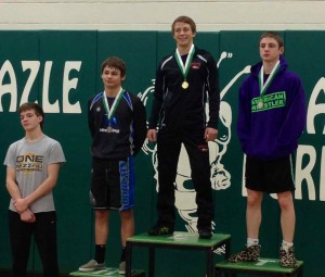 Tanner Kuketz, Cutler McMartin and Chase Roth show off their district medals at Azle on Feb. 1, 2013.  