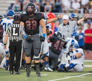 Reagan Page celebrates after a fumble recovery against Nolan Catholic at home Sept. 6.  Photo by Matt Garnett