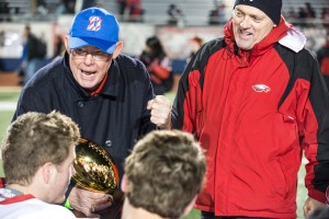 Pastor Ron Hill presents Arygle Head Coach Todd Rodgers with the 3A D2 region 2 finals trophy. Argyle defeated Gladewater in the 3A D2 region 2 finals 42-8.  Photo by Matt Garnett