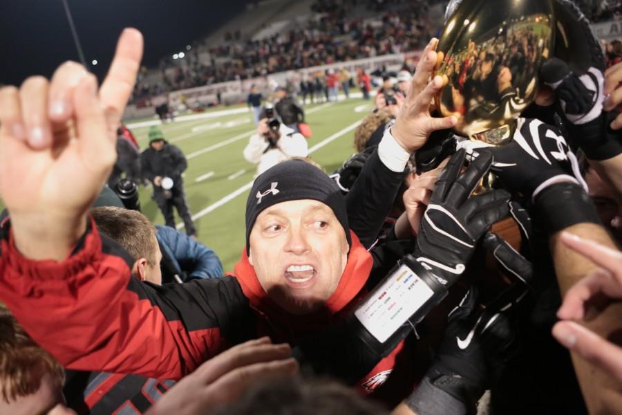 Coach Todd Rodgers celebrates the state semi final victory against Graham that takes the Eagles to the state championship game against Fairfield (15-0) at Dallas Cowboy stadium on Friday, Dec. 20.   Photo by Matt Garnett