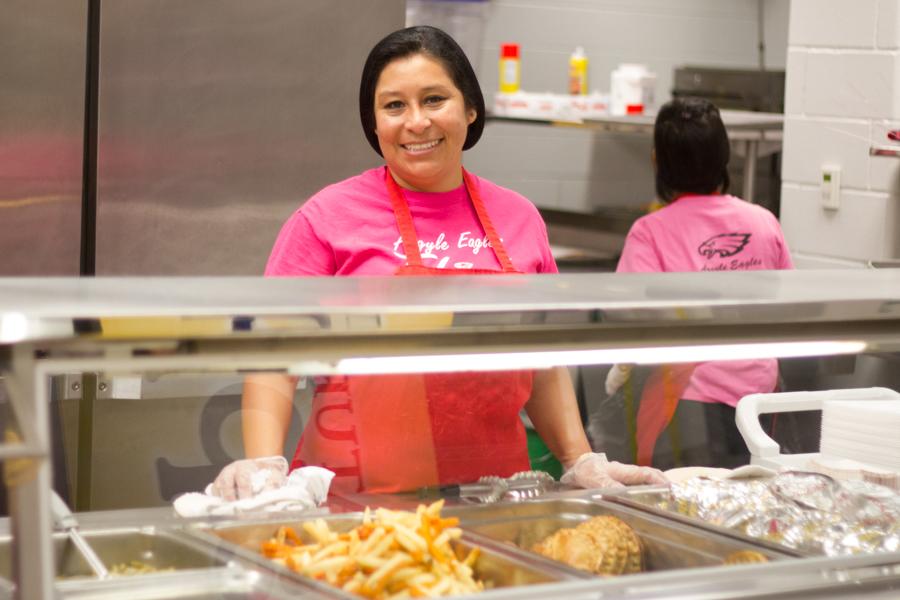 The Cafeteria Workers Serve Students