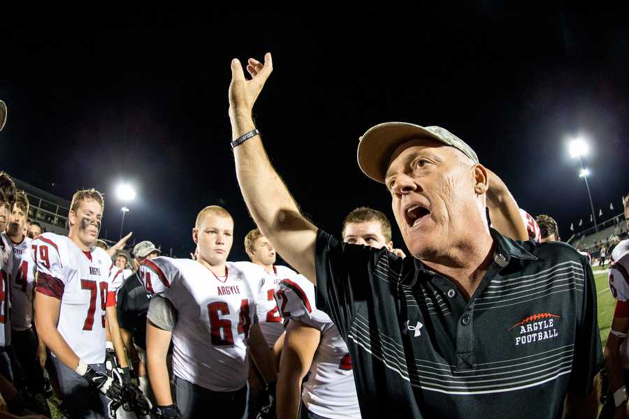 Argyles head football coach Todd Rodgers breaks it out with his players after defeating the Paris Wildcats 38-14 at Paris High School Sept. 26, 2014 in Paris, TX. (Photo by Matt Garnett / The Talon News)