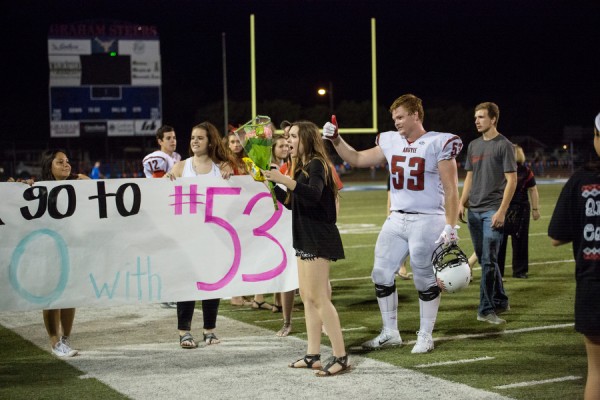 One of the traditions of Argyle, asking someone to prom in a BIG way happened Friday night in Graham as Argyle ended the game against the wildcats at Newton Stadium on Sept. 19, 2014. (Photo by Annabel Thorpe / The Talon News)