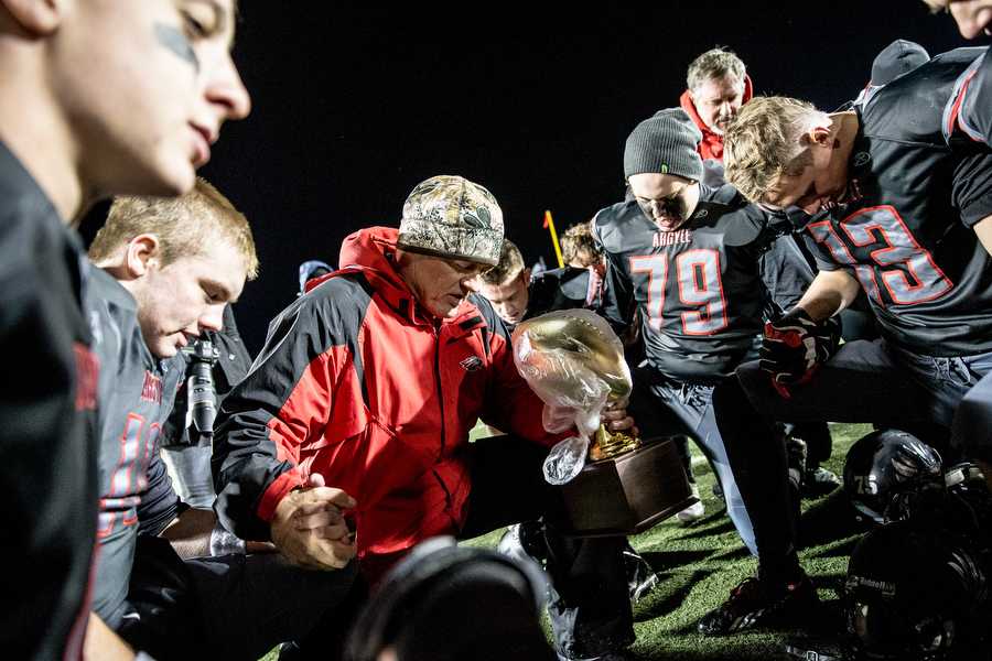Argyle+head+football+coach+Todd+Rodgers+prays+with+his+team+after+a+70-7+victory+over+Lake+Worth+at+Pioneer+Stadium+Nov.+14%2C+2014+in+Saginaw%2C+TX.+%28Photo+by+Matt+Garnett+%2F+For+the+DRC%29