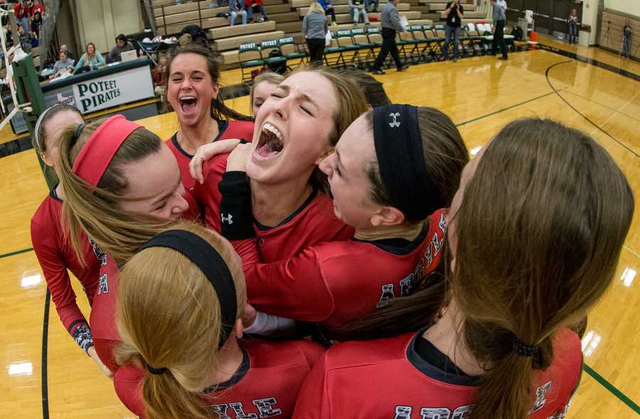 Argyles Katy Keenan (6) screams while she is surrounded by her team after scoring the final point to defeat Melissa at Poteet High School Nov. 15, 2014 in Mesquite, TX. (Photo by Matt Garnett / The Talon News)