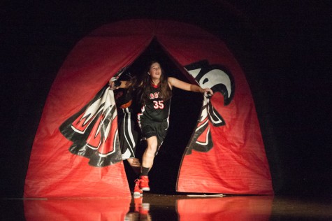 Claire Betzhold bursts through the tunnel at last year's Midnight Madness event. (Photo by Harris Ulman)