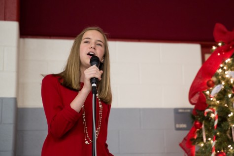 Katie Haynes performs a duet  with her sister Carly at the Angel Tree on Dec. 9 at Argyle High School. (The Talon News / Annabel Thorpe)