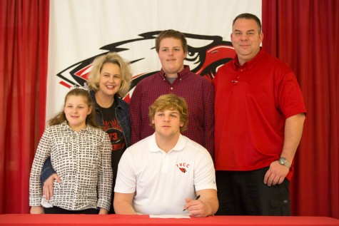 Matt Hiter signs at National Signing Day at Argyle High School on Feb. 4, 2015. (Photo by Caleb Miles / The Talon News)