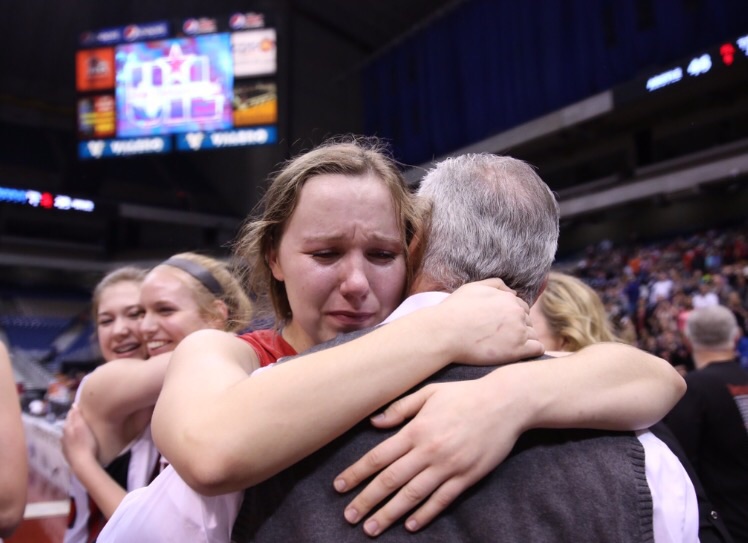 Senior Delaney Sain embaraces Coach Skip Townsend after winning the UIL state championship. (Annabel Thorpe / The Talon News)