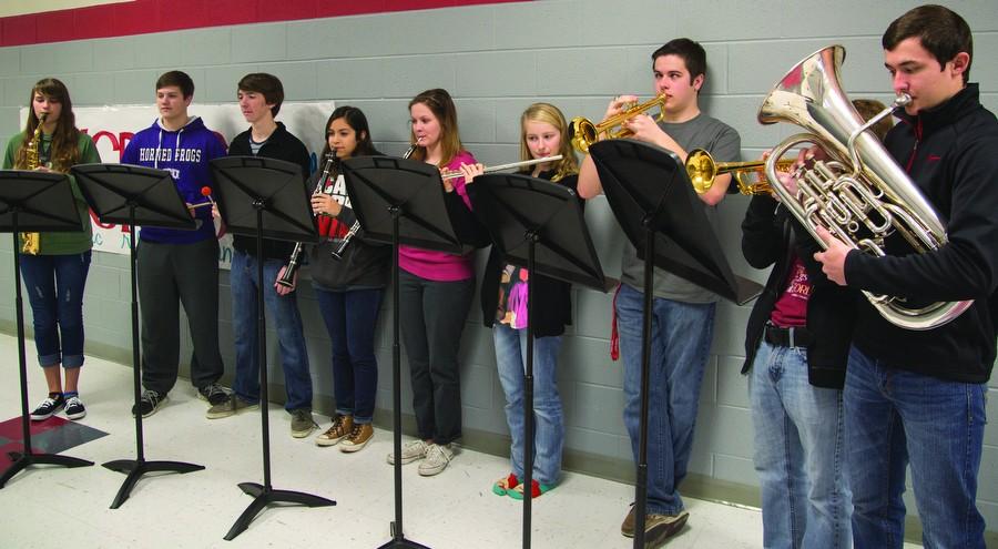 Left to right:  Sierra Albanesi, Morgan Parkey, Riley Barnes, Clarissa Medrano, Emily Young, Carley Johnson, Nathan Little, Aric Kline, and not pictured Ben Roney all qualified for State Concert Band at Argyle High School on Feb. 3, 2015. (Caleb Miles / The Talon News)