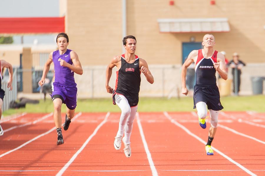 Zach Zembraski races down the track at the district meet at Aubrey High School on April 9, 2015. (Annabel Thorpe / The Talon News)