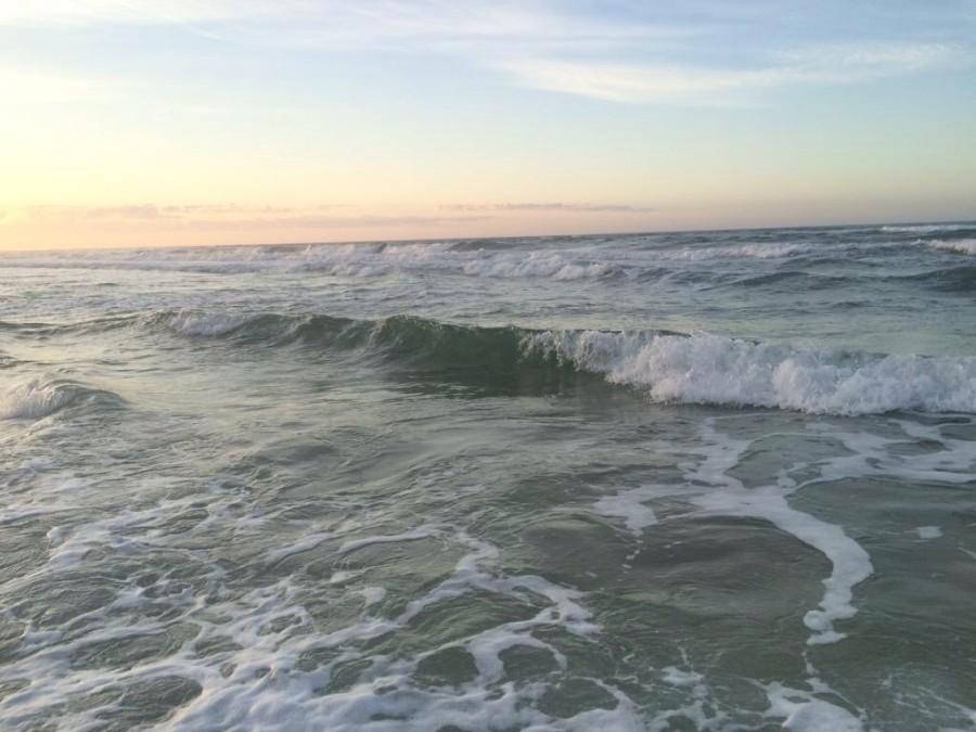 Waves roll in on the beaches of Florida in the evening while the sunsets. (Erin Eubanks / The Talon News)