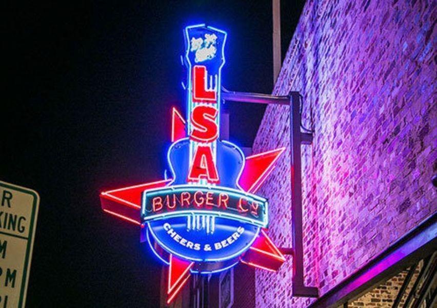 LSA Burgers, a fun burger joint in Denton, TX, illuminates Denton Square with its country style sign.  (Photo Courtesy of LSA Burger Co.)