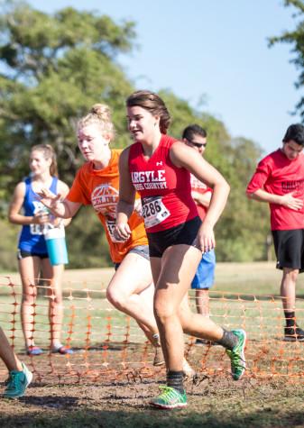 Freshman Caroline Roth races through the obstacle race at Denton Camp Compass on the girls' varsity team. (Annabel Thorpe / The Talon News)