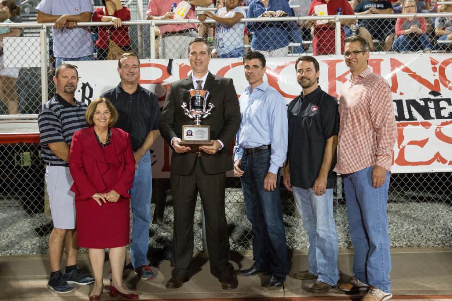 AISD School Board and Dr. Wright pose with Principal James Hill after the award presentation of the Lone Star Cup at Argyle High School on 9/25/15 in Argyle, Texas. (Photo by Caleb Miles / The Talon News)