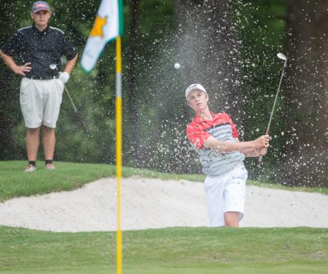 Argyle's Alex Isakson chips the ball from the bunker in the UIL state golf tournament at the Onion Creek Golf Course in Austin, Texas on April 27, 2015. (Christopher Piel/The Talon News)