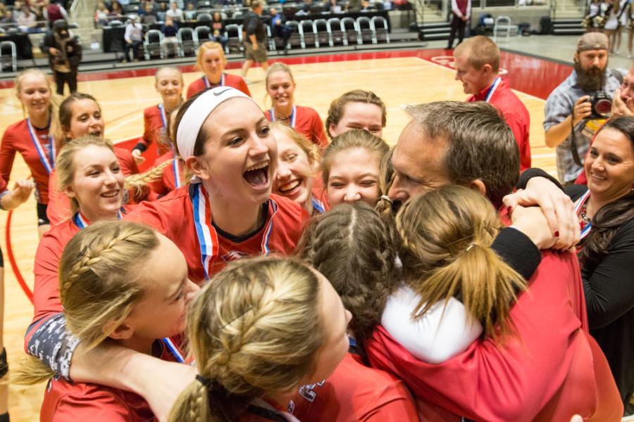 Junior Halee Van Poppel jumps in the group after defeating Bushland 3-0 in the 4A state championship on Saturday, Nov. 21 at Curtis Culwell Center in Garland, TX. (Caleb Miles / The Talon News)
