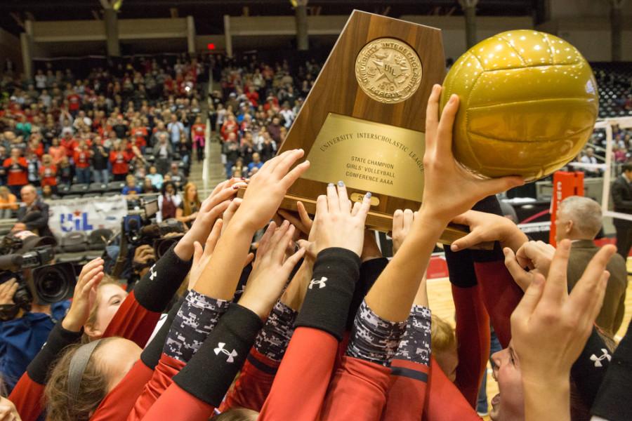 Lady Eagles celebrate with the 4A state trophy and golden volleyball after winning in a 3-0 sweep against the state semifinalist team, Bushland on Saturday, Nov. 21 at Curtis Culwell Center in Garland, TX. (Caleb Miles / The Talon News)