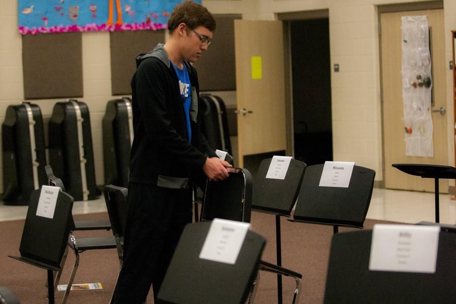 Student sets up for region band clinic at Argyle High School. (Brayden Ratcliff / The Talon News)