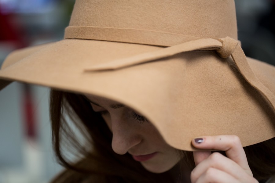 Erin Eubanks pulls off the stylish floppy hat thats taken over winter fashion this season on Thursday, Jan. 21 at Argyle High School in Argyle, TX. (Annabel Thorpe / The Talon News)