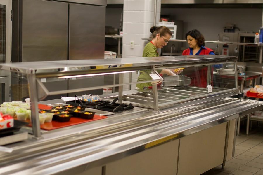 Cafeteria workers clean up after lunch. (Erin Eubanks / The Talon News)