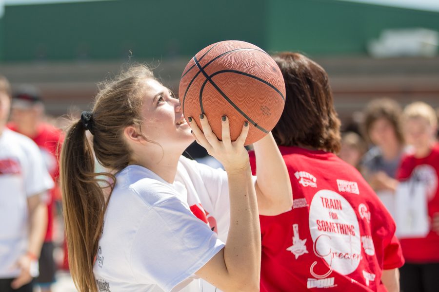 Sophomore Sophie Betzhold takes a shot during an attempt to break the Guinness knockout world record. Despite not breaking the Guinness record they did break the Recordsetter.com record amid the opening of the Alex Betzhold Memorial Basketball Court on Friday, May 6, 2016 at Argyle High School in Argyle, TX. (Caleb Miles / The Talon News)