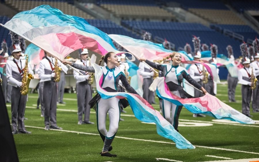 The color guard performs in the show IGeneration at the finals of the UIL State Band competition at the Alamodome in San Antonio, TX. (GiGi Robertson/The Talon News)