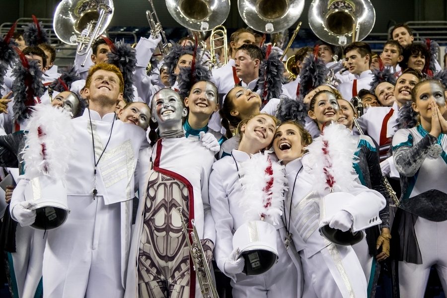 Senior+leaders+Reeves+Moseley%2C+Madison+Darnell%2C+Erin+Riley+and+Haley+Emerson+celebrate+with+the+band+as+they+learn+they+are+in+the+top+ten+bands+to+move+on+to+the+finals+at+the+UIL+State+Band+competition+at+the+Alamodome+in+San+Antonio%2C+TX.+%28Erin+Eubanks%2FThe+Talon+News%29