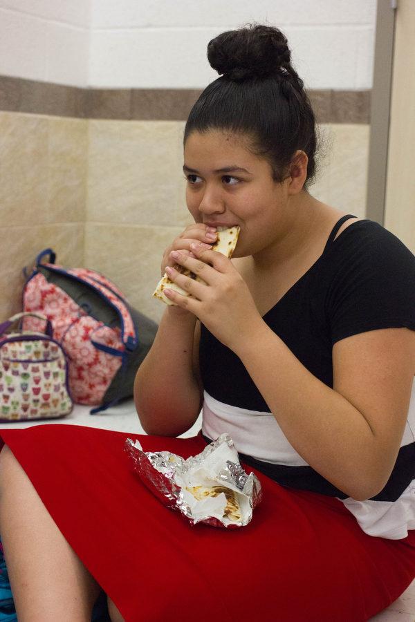 Freshman Jazmin Moreno enjoys her burrito brought from home at Argyle High School on March 3, 2017 in Argyle, Texas. (Kenzie Hindman/ The Talon News)
