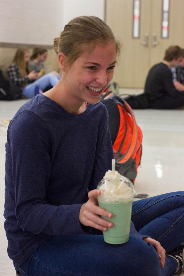 Freshman Taylor Childress enjoys her shamrock frappuccino from The Brewed Awakening at Argyle High School on March 3, 2017 in Argyle, Texas. (Kenzie Hindman/ The Talon News)