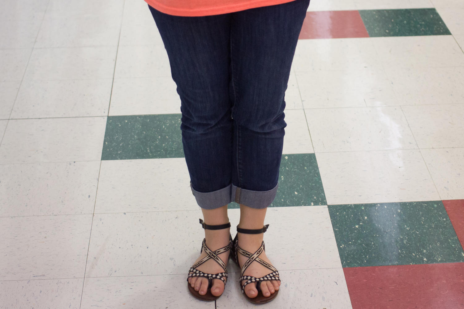 Student stands in hall displaying  proper dress code. (Elli Marusa/The Talon News)
