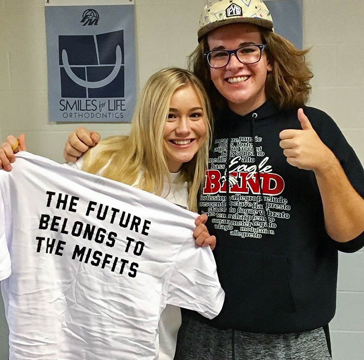 Senior Mira Lilliard and junior Jake Pool smile with their free merchandise from Jostens after winning the dance competition at the Find Your Grind Leadership Conference, on September 25th, 2017 at Flower Mound High School. (courtesy of Jeanna Sutton) 