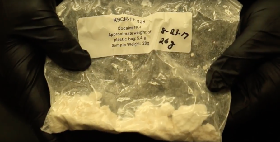 AISD Police Chief Paul Cairney shows a sample of cocaine used for drug dog training in Argyle High School on Sept. 14, 2017. (Lauren Landrum/The Talon News)