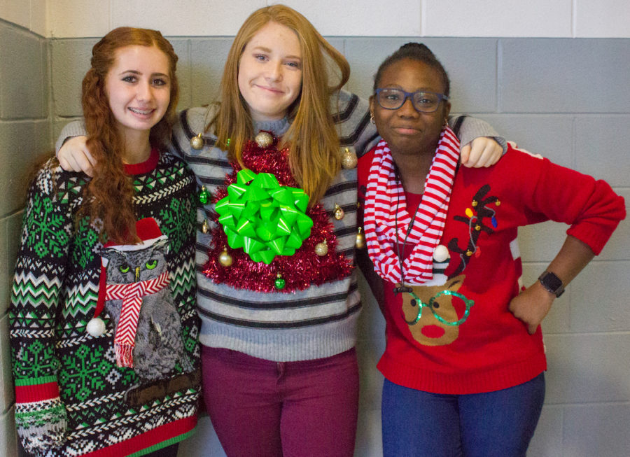 As they show off their extravagant sweaters, freshman pose for a photo on December 15, 2017. (Katy McBee | The Talon News)