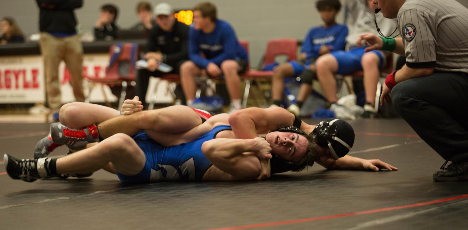 Wrestlers take on opponents at Argyle High School in Argyle Texas for a Quad tournament.