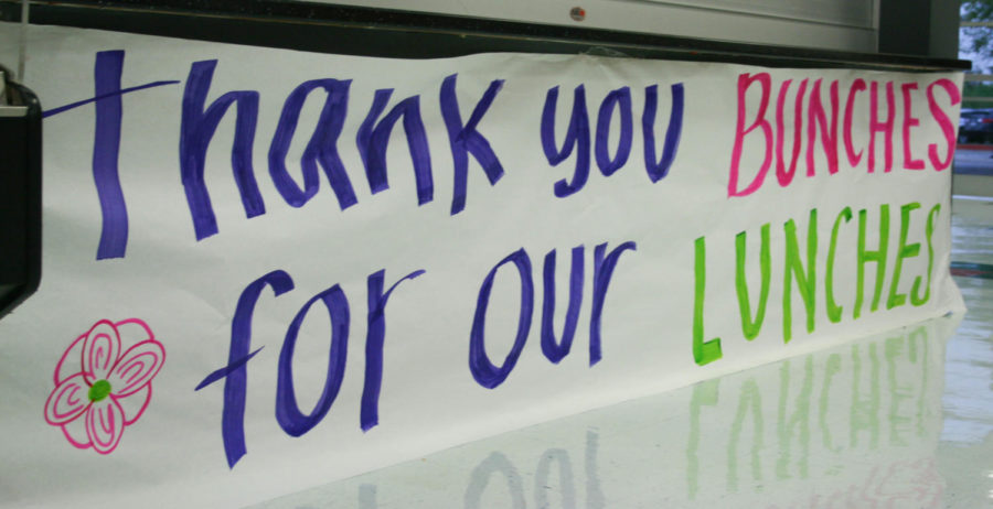 Challenge Day Club hangs posters in appreciation for all the staff members that work for the school on March 27, 2018. (Katie Ray / The Talon News)