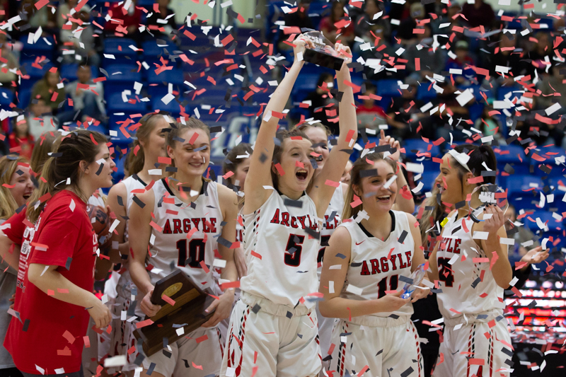 Junior Rhyle McKinney holds up the regional championship trophy after the Argyle Lady Eagles defeat the Levelland Loboettes in the Region 1 class 4A Final Championship game at Lubbock Christian University in Lubbock, Texas, on February 23, 2019.(Andrew Fritz | The Talon News)