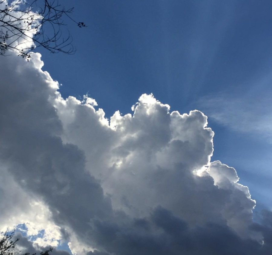 The sun behind the clouds on a summer day.  (Kristjan Feltes / The Talon News)
