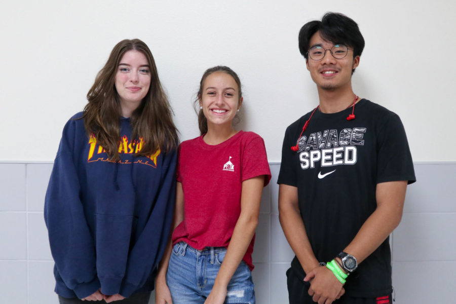 Three students new to the school and country pose on September 25, 2019 at Argyle High School. (Emma Campbell / The Talon News)
