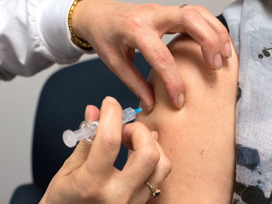 Vaccine hesitancy has lead to the outbreak of diseases (Administering Flu Vaccine by Government of Prince Edward Island is licensed under CC BY-NC-ND 2.0).