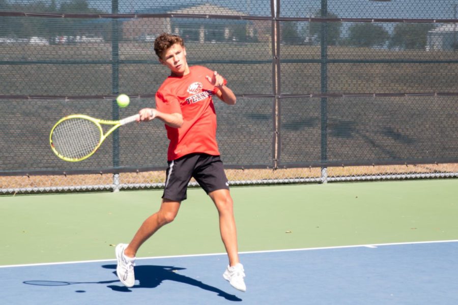 Varsity tennis player Nick Loveday competes in the Regional Quarterfinals at Krum High School on October 22, 2019. (Katie Ray / The Talon News)