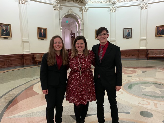 Senior Savanna Lessley, Debate Coach Jessica Reynolds, and junior Billy Mykel pose in the capitol building in Austin at the Congressional Debate state meet. (Photo courtesy of Jessica Reynolds)