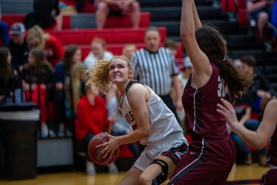 Junior Shelby Henches concentrates as she begins a layup against the Bridgeport Sissies on Jan. 10, 2020. (Alex Daggett / The Talon News)