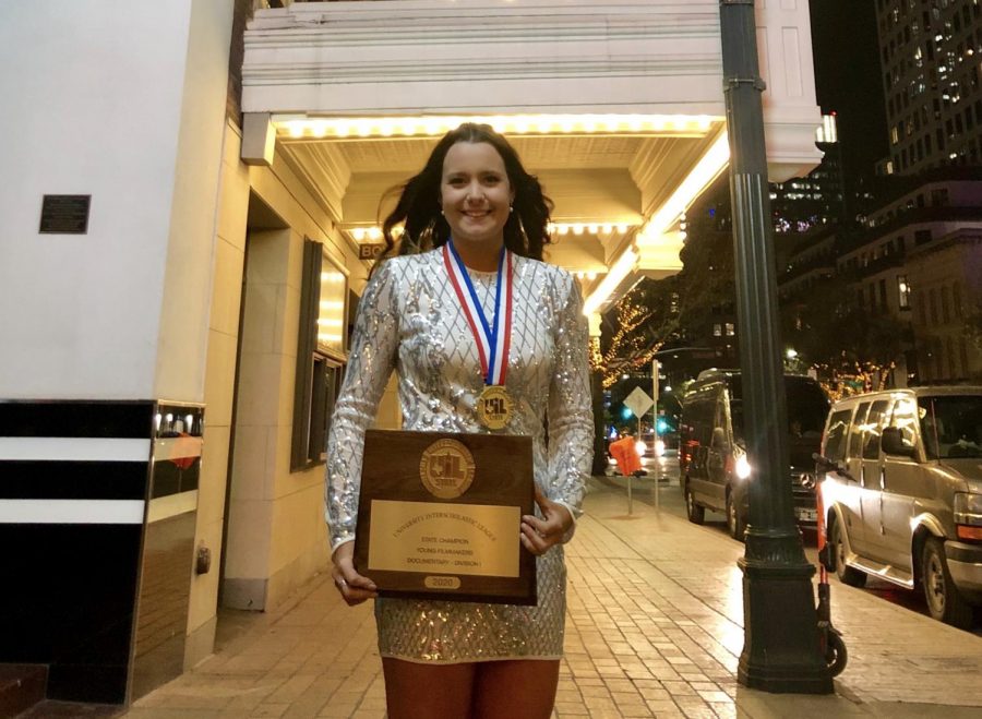 Senior Campbell Wilmot poses with her Division 1 Plaque at the UIL State Film Festival. (Stacy Short | The Talon News)