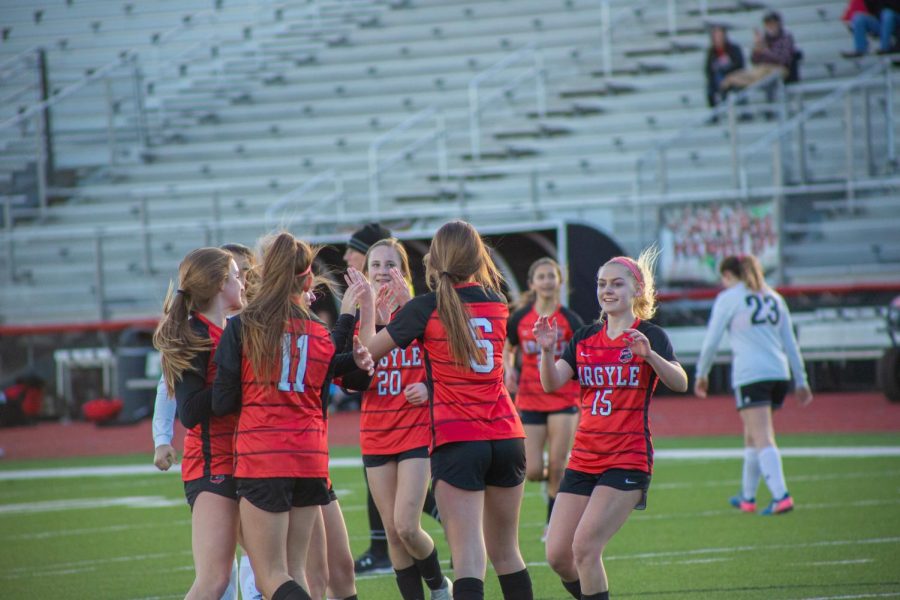 The Lady Eagles celebrate after beating Springtown 7-0 on February 21, 2020 at Argyle High School. (Alex Daggett / The Talon News)