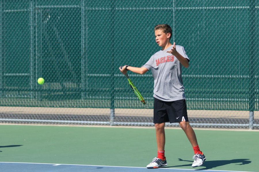 Freshman Nick Loveday competes in a tennis match at Argyle High School in Argyle, Texas on Oct. 19, 2017. (Jaclyn Harris | The Talon News)